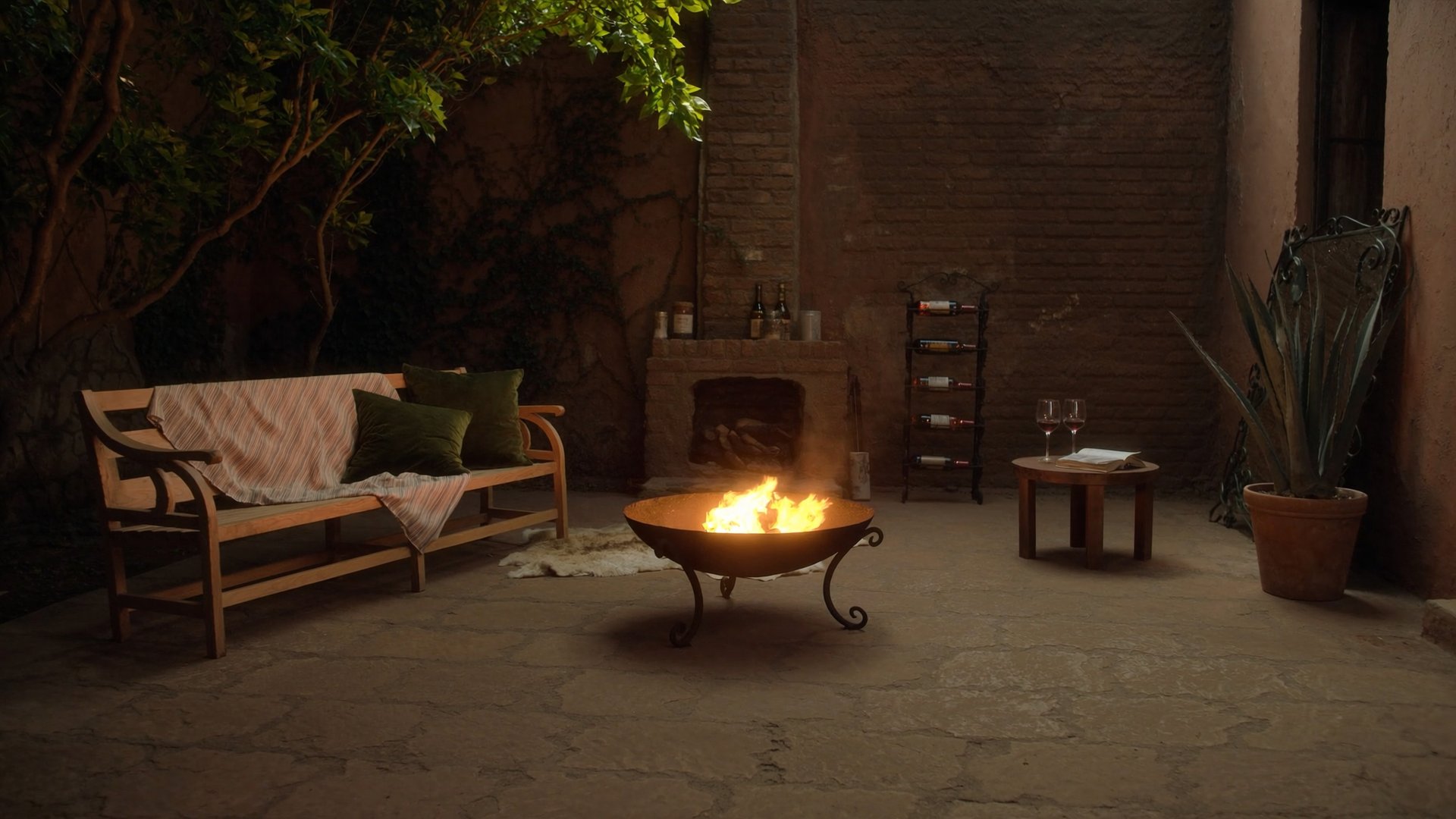 Patio Brasa Negra con fogonero encendido al atardecer
